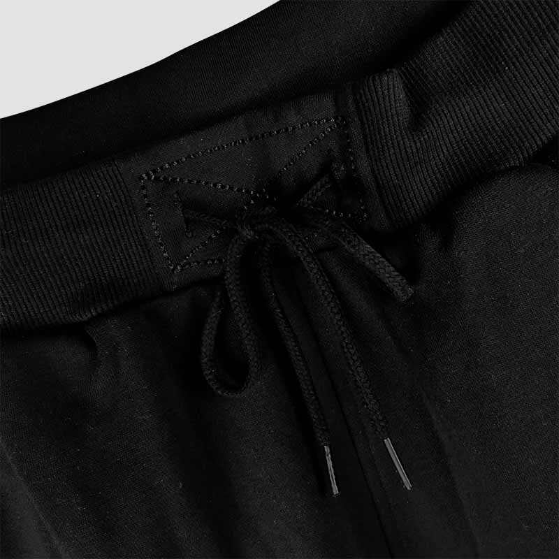 Close up view of Hard & Smart Sports Coaching joggers in black